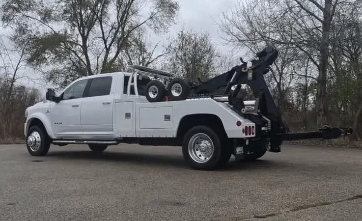 Oakville wrecker equipment securing damaged vehicle